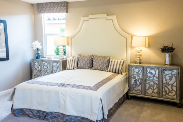 Peaceful white bedroom with neatly made bed